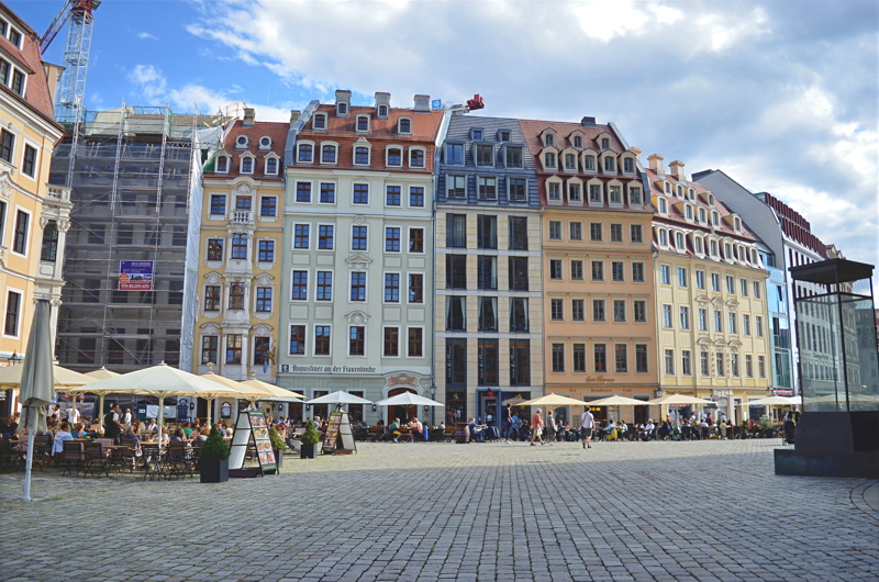 29 - The historic Neumarkt Square in Dresden, featuring a row of faithfully reconstructed baroque-style buildings and modern architectural infills next to the Frauenkirche